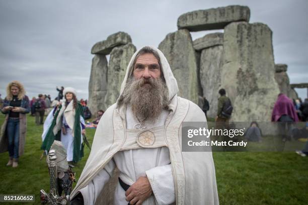 Druid Merlin poses for a photograph as druids, pagans and revellers gather in the centre at Stonehenge, hoping to see the sun rise, as they take part...
