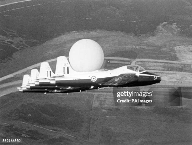 The Royal Air Force's Blades aerobatic team fly over the giant domes at RAF Fylingdales, the early warning station in Yorkshire.