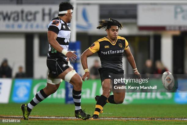 Johnny Fa'auli of Taranaki kicks into a gap during the round six Mitre 10 Cup match between Hawke's Bay and Taranaki at McLean Park on September 23,...