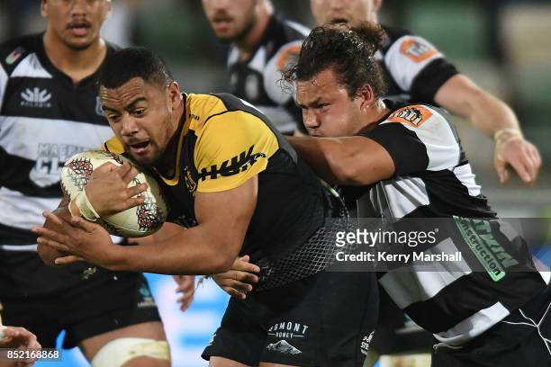Toa Halafihi of Taranaki tries to get away from Pouri Rakete-Stones of Hawke's Bay during the round six Mitre 10 Cup match between Hawke's Bay and...