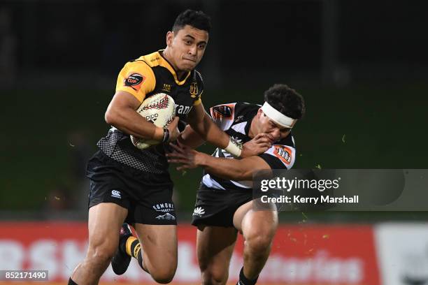 Stephen Perofeta of Taranaki makes a break during the round six Mitre 10 Cup match between Hawke's Bay and Taranaki at McLean Park on September 23,...