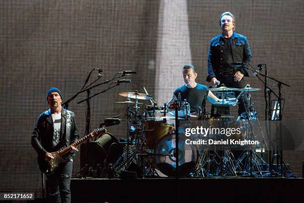 Musicians The Edge, Larry Mullen Jr., and Bono of U2 perform on stage on the final night of U2: The Joshua Tree Tour 2017 at SDCCU Stadium on...