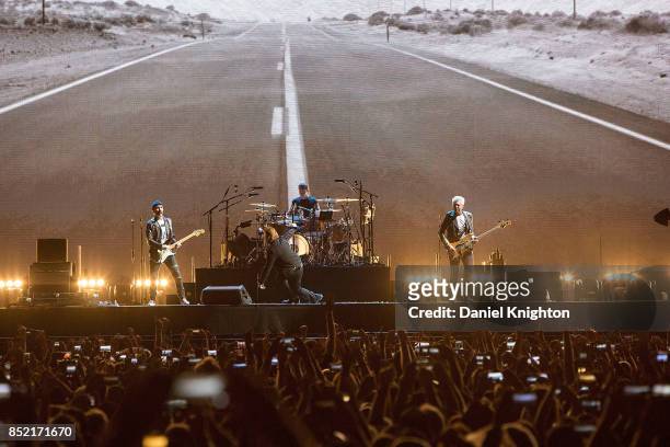 Musicians The Edge, Bono, Larry Mullen Jr., and Adam Clayton of U2 perform on stage on the final night of U2: The Joshua Tree Tour 2017 at SDCCU...