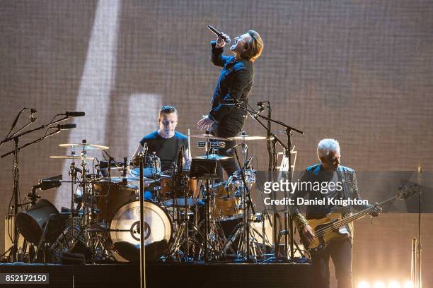 Musicians Larry Mullen Jr., Bono, and Adam Clayton of U2 perform on stage on the final night of U2: The Joshua Tree Tour 2017 at SDCCU Stadium on...