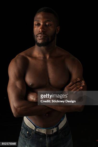 stoic black muscleman shirtless with arms crossed 138 - fighter portraits 2013 stock pictures, royalty-free photos & images