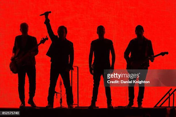 Musicians Adam Clayton, Bono, Larry Mullen Jr., and The Edge perform on stage on the final night of U2: The Joshua Tree Tour 2017 at SDCCU Stadium on...