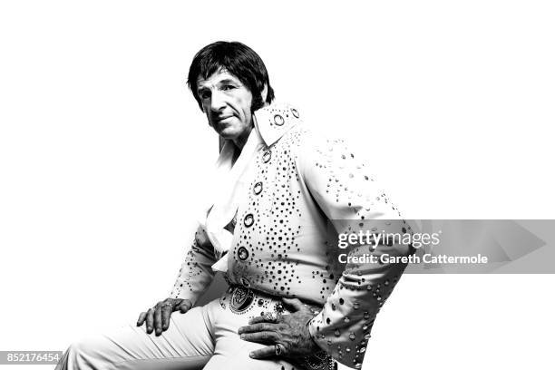 Duncan Mckellar A Tractor Combine Operator from Andover Hampshire poses in a portrait studio during the World's largest gathering of Elvis Presley...