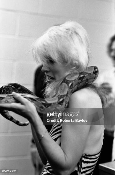 Photo of Debbie HARRY and BLONDIE; Debbie Harry with snake backstage at the Philadelphia Spectrum