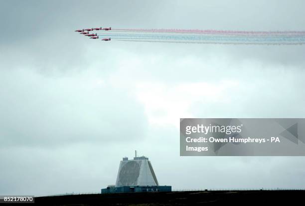 The RAF Red Arrows display team fly over RAF Fylingdales as they help mark the 50th anniversary of the early warning station which dominates the...