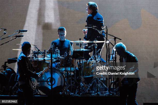 Musicians The Edge, Larry Mullen Jr., Bono, and Adam Clayton of U2 perform on stage on the final night of U2: The Joshua Tree Tour 2017 at SDCCU...