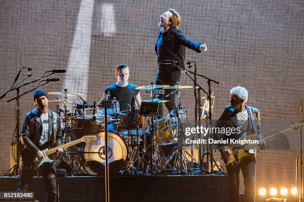 Musicians The Edge, Larry Mullen Jr., Bono, and Adam Clayton of U2 perform on stage on the final night of U2: The Joshua Tree Tour 2017 at SDCCU...