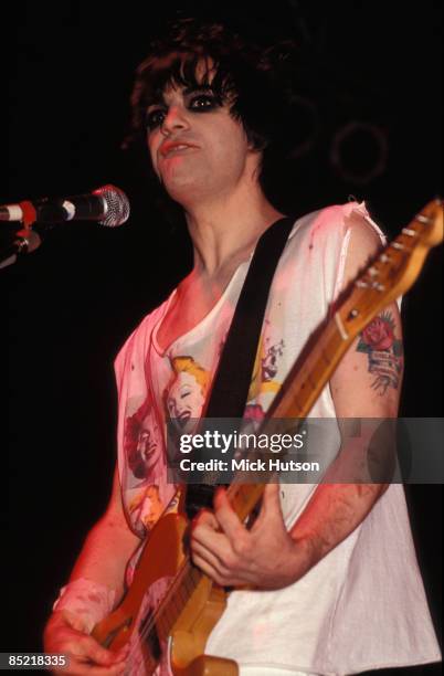 Photo of Richey EDWARDS and MANIC STREET PREACHERS, Richey Edwards performing live onstage, showing tattoo and '4 Real' scar