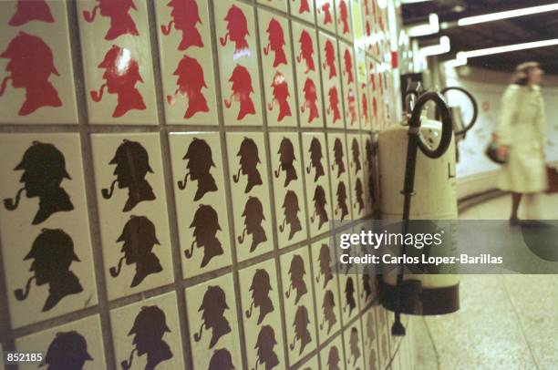 Original tile work featuring fictional detective Sherlock Holmes inside the Baker Street Station of The London Underground railway network September...