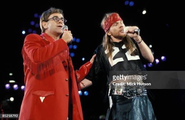 Photo of Axl ROSE and Elton JOHN, L-R: Elton John, Axl Rose performing live onstage at Freddie Mercury Tribute Concert