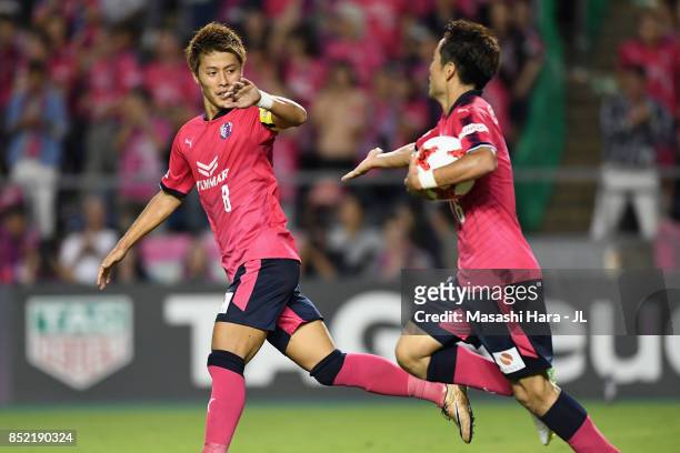 Kota Mizunuma of Cerezo Osaka celebrates scoring his side's first goal with his team mate Yoichiro Kakitani of Cerezo Osaka during the J.League J1...