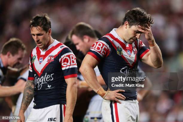Aidan Guerra of the Roosters and team mates look dejected at fulltime during the NRL Preliminary Final match between the Sydney Roosters and the...