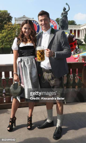 Robert Lewandowski and his wife Anna Lewandowska of FC Bayern Muenchen attend the Oktoberfest beer festival at Kaefer Wiesenschaenke tent at...