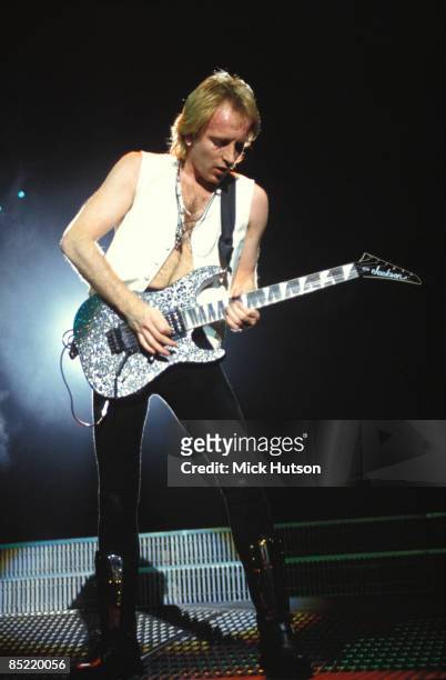 Phil Collen of Def Leppard performs on stage circa 1992.