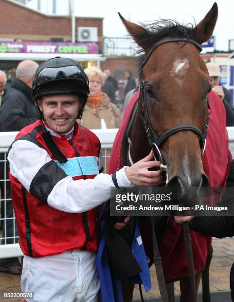 Tony Hamilton with Hi There after winning the William Hill Download The App Handicap Stakes during Day One of the William Hill Ayr Gold Cup Festival...