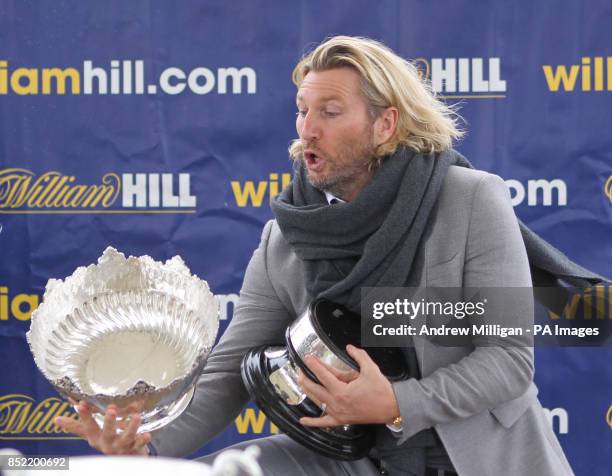Robbie Savage prepares to hand out the Kilkerran Cup after the horse Hi There won The William Hill Download The App Handicap Stakes during Day One of...