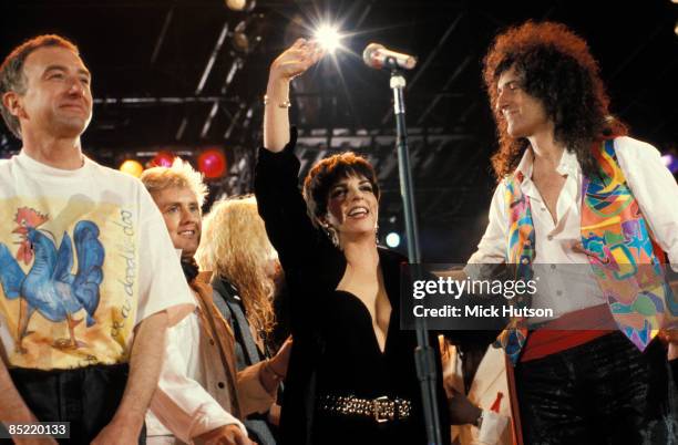 Photo of John DEACON and Brian MAY and Liza MINELLI and QUEEN, L-R: John Deacon, Roger Taylor, Liza Minelli, Brian May performing on stage at the...