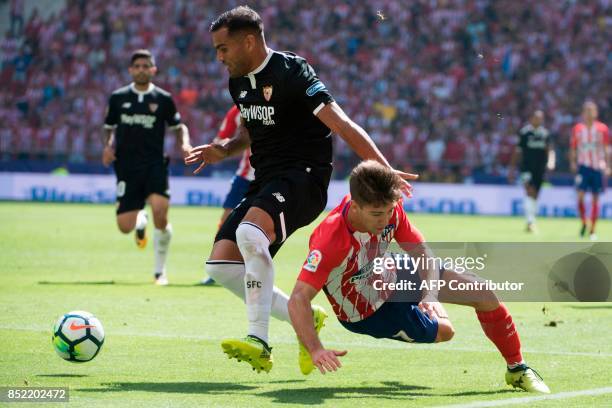 Sevilla's midfielder from France Steven N'Zonzi vies with Atletico Madrid's forward from Argentina Luciano Vietto during the Spanish league football...