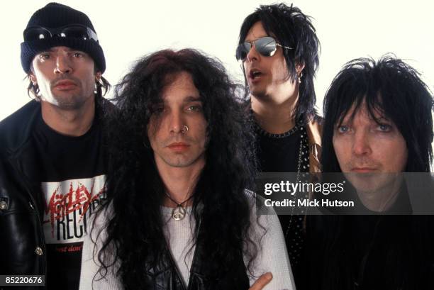 Photo of Mick MARS and John CORABI and Nikki SIXX and Tommy LEE and MOTLEY CRUE, L-R: Tommy Lee, John Corabi, Nikki Sixx, Mick Mars, posed, studio