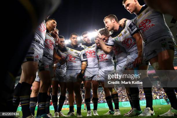 Gavin Cooper of the Cowboys speaks to the his team mates as the Cowboys celebrate victory during the NRL Preliminary Final match between the Sydney...