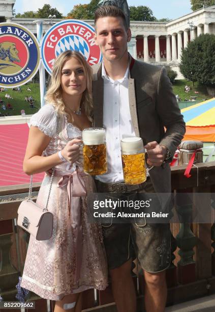 Niklas Suele of FC Bayern Muenchen and his girlfriend Melissa Halter attend the Oktoberfest beer festival at Kaefer Wiesenschaenke tent at...