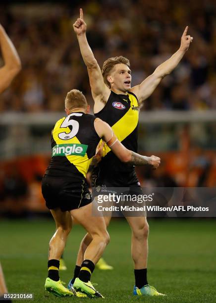 Dan Butler of the Tigers celebrates during the 2017 AFL Second Preliminary Final match between the Richmond Tigers and the GWS Giants at the...