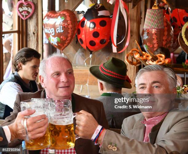 Uli Hoeness, President of FC Bayern Muenchen and head coach Carlo Ancelotti of FC Bayern Muenchen atttend the Oktoberfest beer festival at Kaefer...