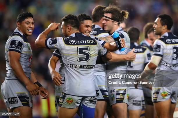 Antonio Winterstein of the Cowboys celebrates with Te Maire Martin of the Cowboys after winning the NRL Preliminary Final match between the Sydney...