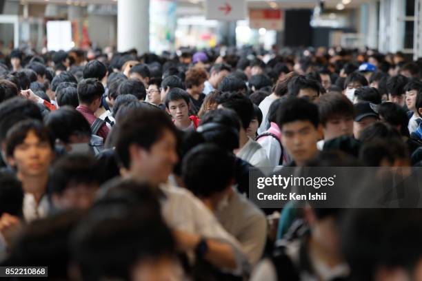 Visitors wait in line to enter the venue during the Tokyo Game Show 2017 at Makuhari Messe on September 23, 2017 in Chiba, Japan.