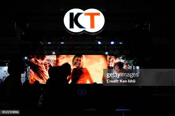 Visitors walk past the Koei Tecmo Holdings Co. Booth during the Tokyo Game Show 2017 at Makuhari Messe on September 23, 2017 in Chiba, Japan.