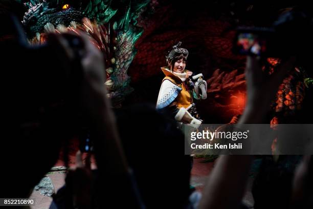 Model dressed as the Monster Hunter World video game stands at the Capcom game co. Booth during the Tokyo Game Show 2017 at Makuhari Messe on...