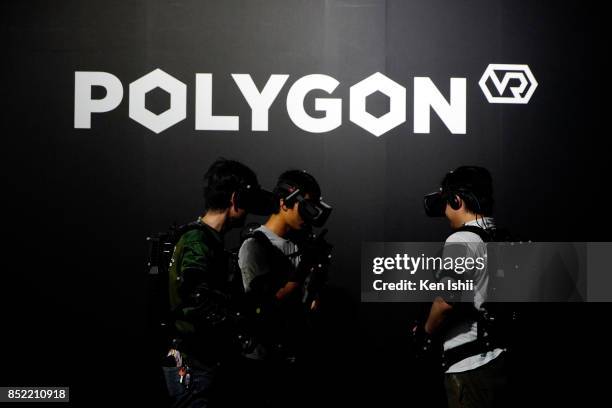 Visitors wearing VR headset play the virtual reality game in the Wargaming Japan booth during the Tokyo Game Show 2017 at Makuhari Messe on September...