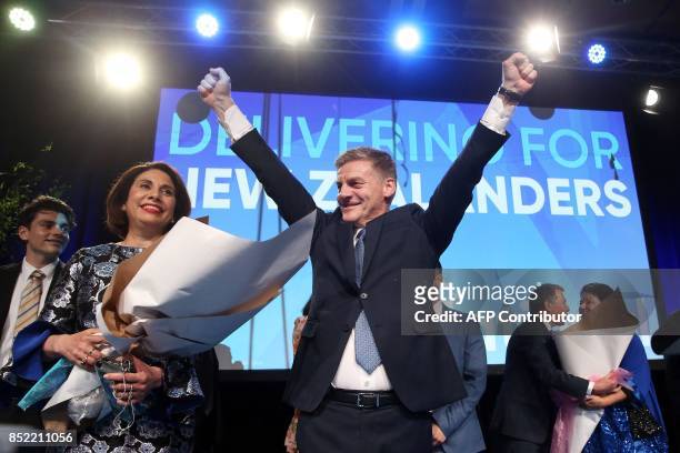 Leader of the National Party Bill English gestures next to his wife Mary onstage at the party's election event at SkyCity Convention Centre in...