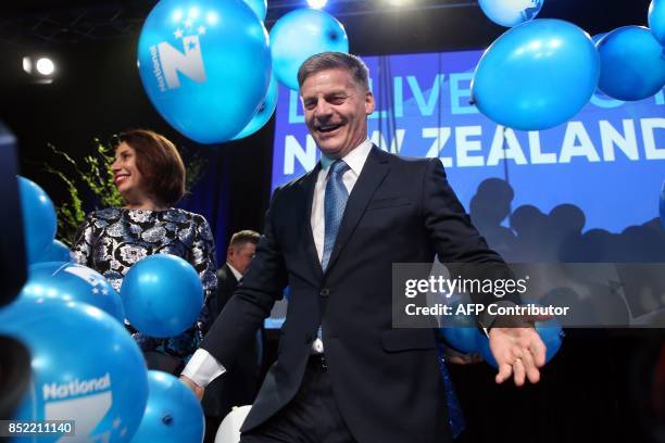 Leader of the National Party Bill English reacts onstage next to his wife Mary at the party's election event at SkyCity Convention Centre in Auckland...