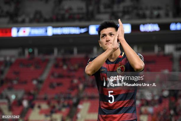 Naomichi Ueda of Kashima Antlers applaud supporters after his side's 2-1 victory in the J.League J1 match between Kashima Antlers and Gamba Osaka at...
