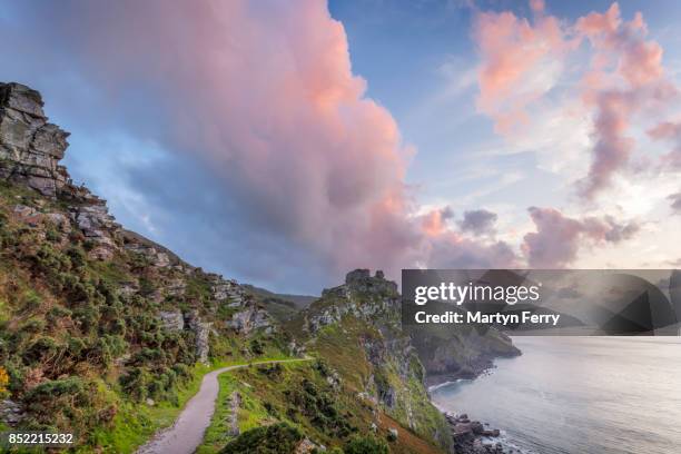 coast path at sunset, valley of rocks, lynton, exmoor national park, devon, uk - devon stock pictures, royalty-free photos & images