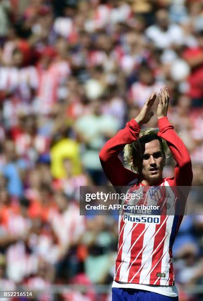 Atletico Madrid's forward from France Antoine Griezmann celebrates a goal during the Spanish league football match Club Atletico de Madrid vs Sevilla...