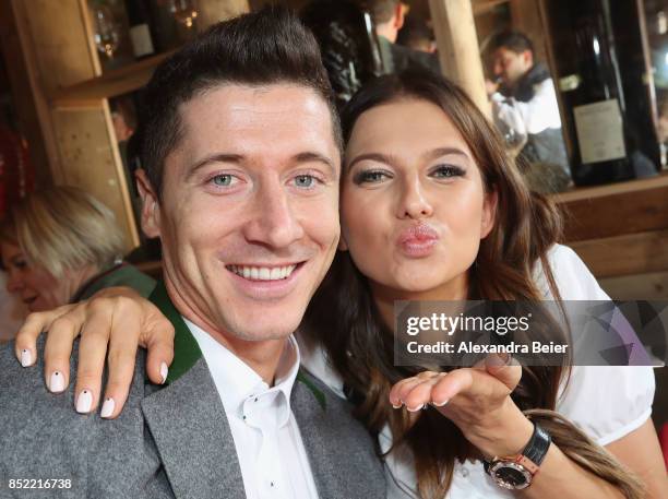 Robert Lewandowski and his wife Anna Lewandowska of FC Bayern Muenchen attend the Oktoberfest beer festival at Kaefer Wiesenschaenke tent at...