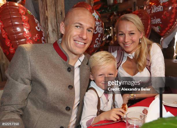 Arjen Robben of FC Bayern Muenchen, his wife Bernadien Eillert (and their son attend the Oktoberfest beer festival at Kaefer Wiesenschaenke tent at...