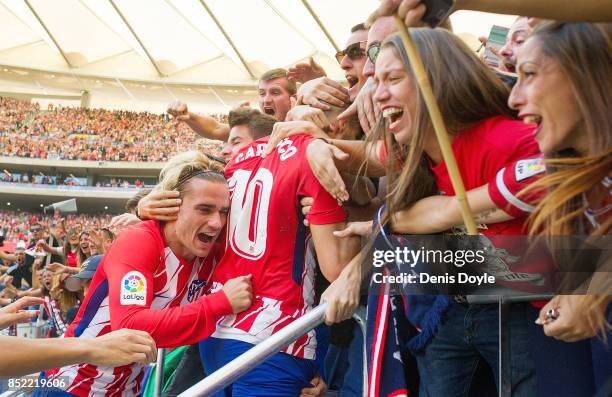 Antoine Greizmann of Club Atletico de Madrid celebrates with fans after his side scored their teamÕs 1st goal during the La Liga match between...