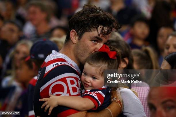 Aidan Guerra of the Roosters hugs his family after defeat during the NRL Preliminary Final match between the Sydney Roosters and the North Queensland...