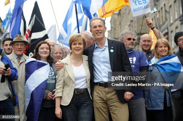 Nicola Sturgeon with Blair Jenkins making their way up Calton Hill during a march and rally in Edinburgh, calling for a Yes vote in next year's...