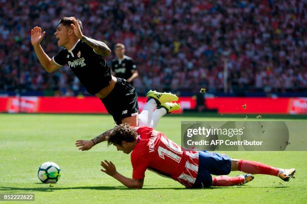 Sevilla's midfielder from Argentina Joaquin Correa vies with Atletico Madrid's defender from Croatia Sime Vrsaljko during the Spanish league football...