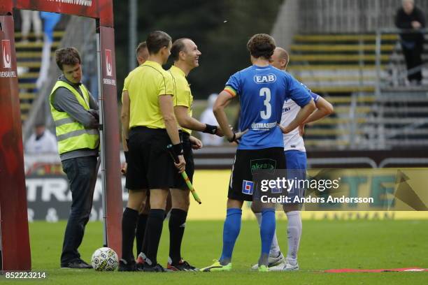 Head ref Jonas Eriksson tosses the coin before the game at Orjans Vall on September 23, 2017 in Halmstad, Sweden.