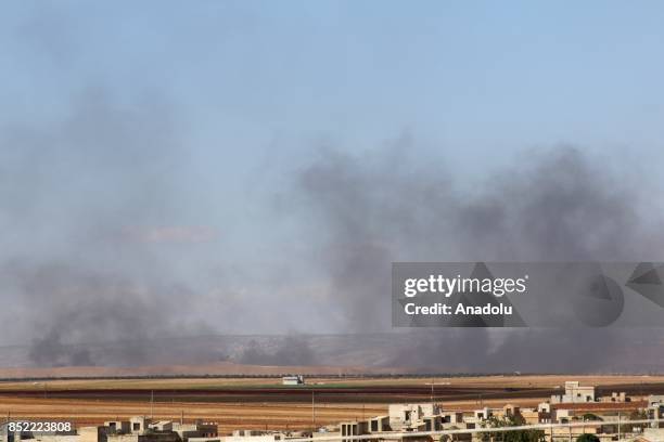 Smoke rises after airstrikes hit Ebla village in southern Idlib, Syria on September 23, 2017.