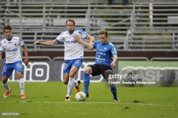 Jon Gudni Fjoluson of IFK Norrkoping and Gabriel Gudmundsson of Halmstad BK compete for the ball at Orjans Vall on September 23, 2017 in Halmstad,...